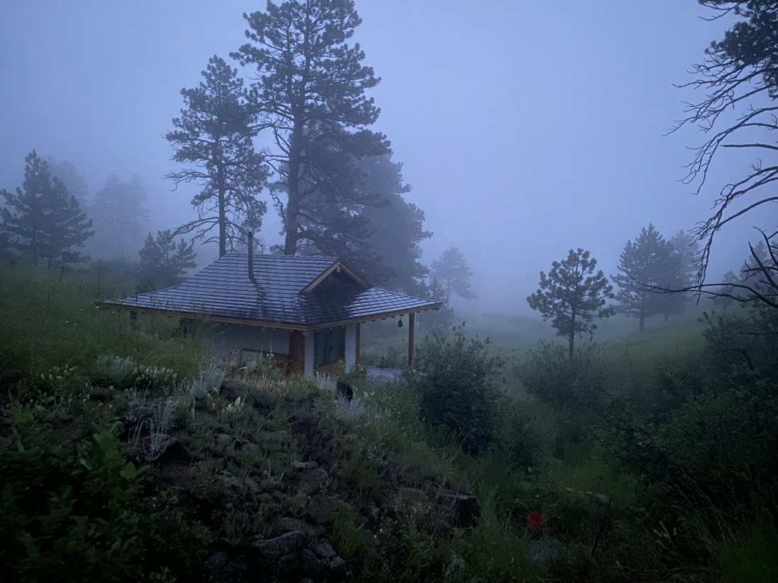 The teahouse in dusk fog among the pines
